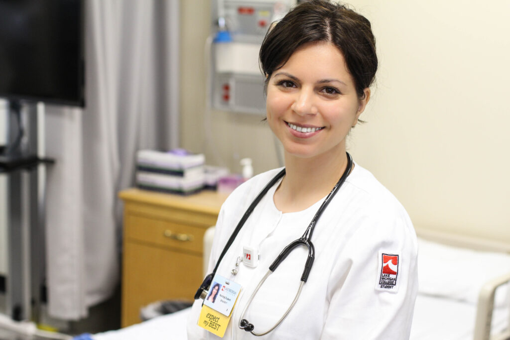 Nurse smiling at the camera.