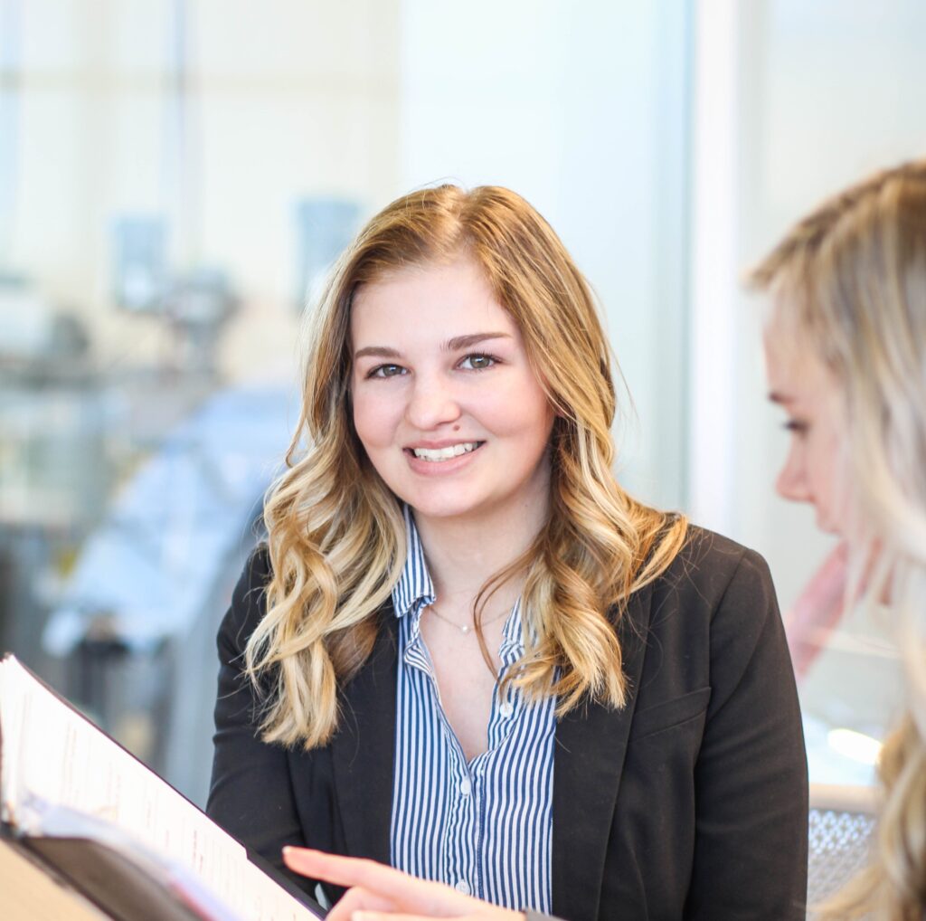 Business woman smiling at camera.