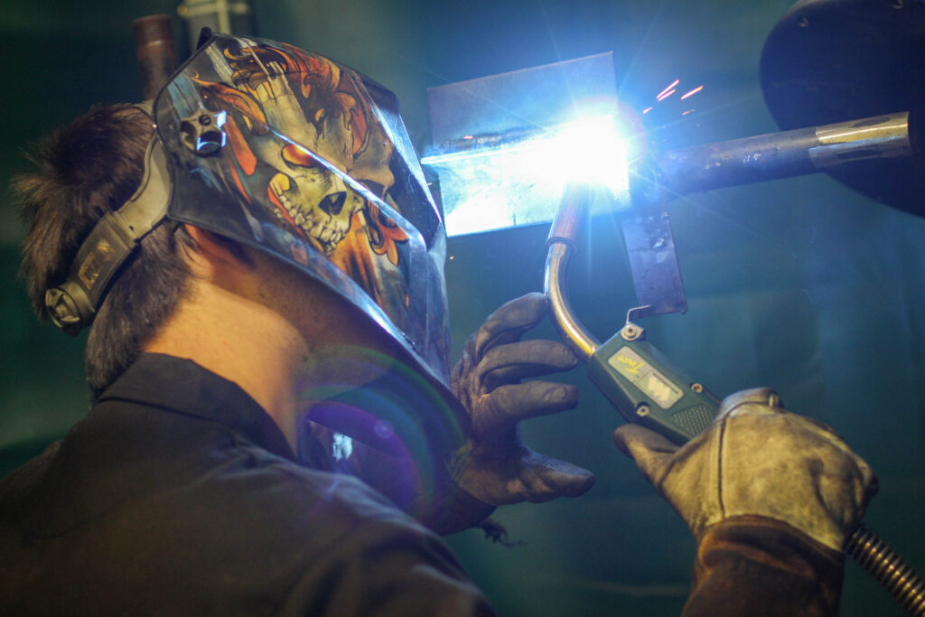 Person with mask on welding