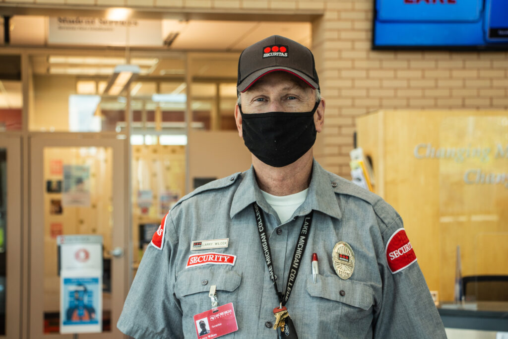 Security man smiling at the camera.