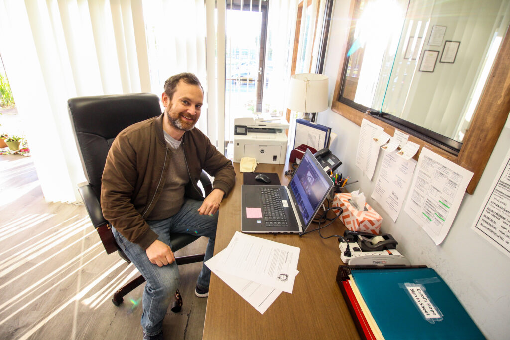 Smiling man working at desk