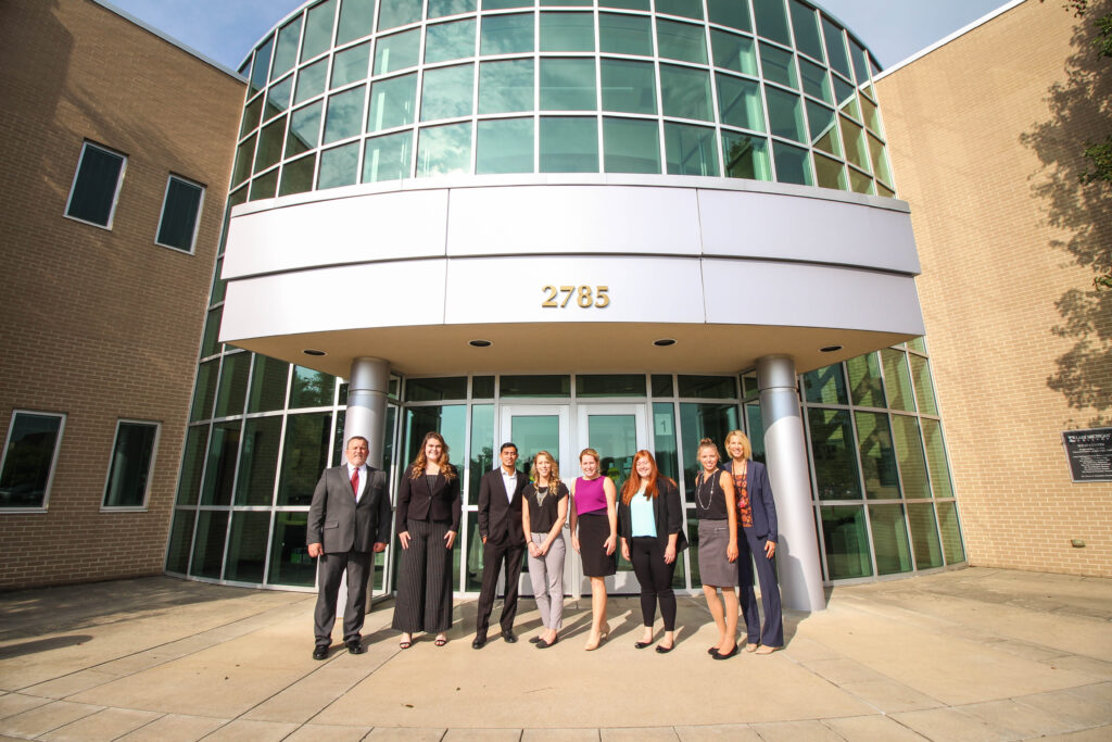 Group of business people standing in front of a building