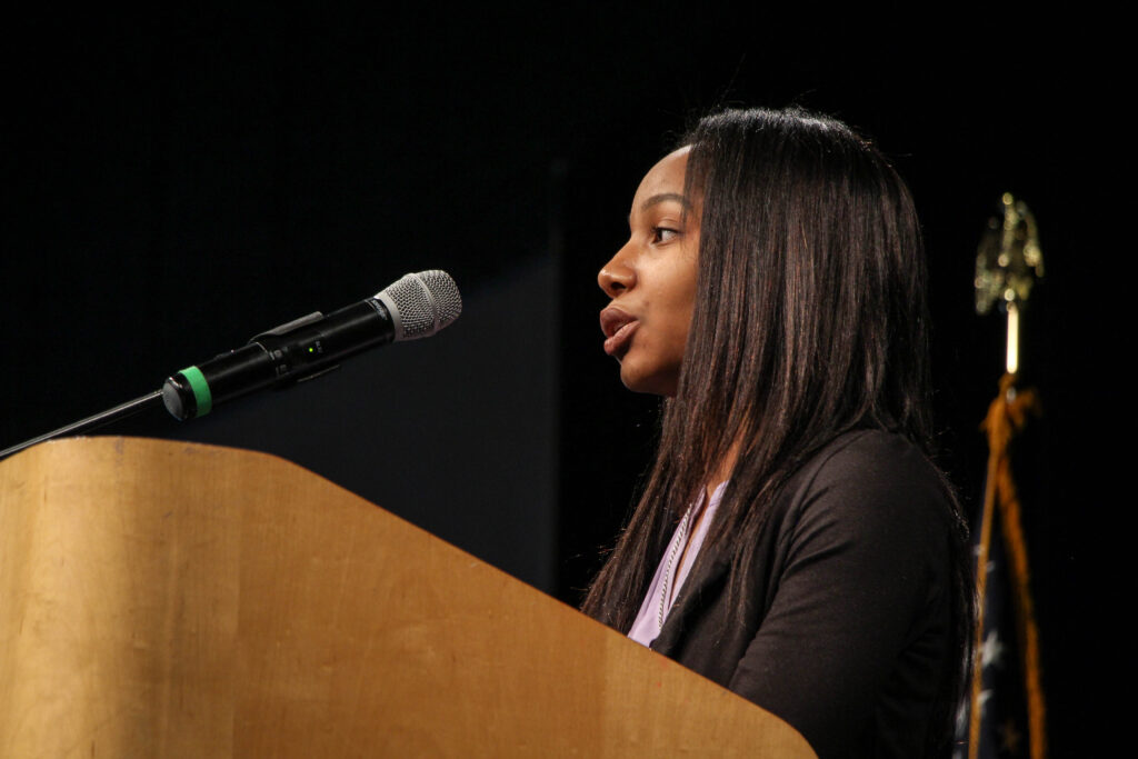 Woman speaking at podium
