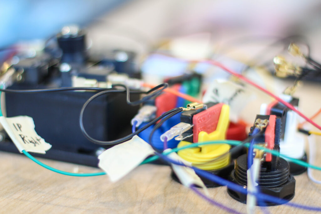 Colorful wires clipped to a system.