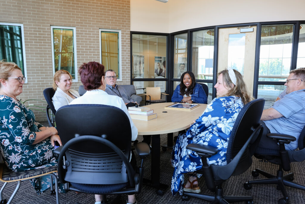 Professionals sitting around a table having a meeting