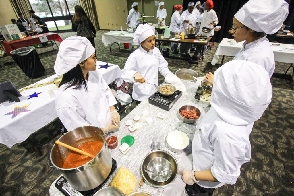 A group of cooks working together.
