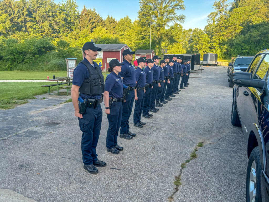 A line of cops standing together.