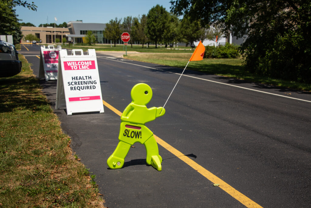 A safety sign on the side of a road.