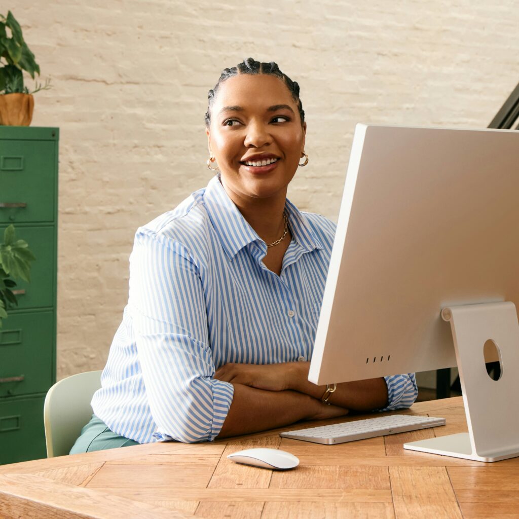 Smiling businesswoman working at computer