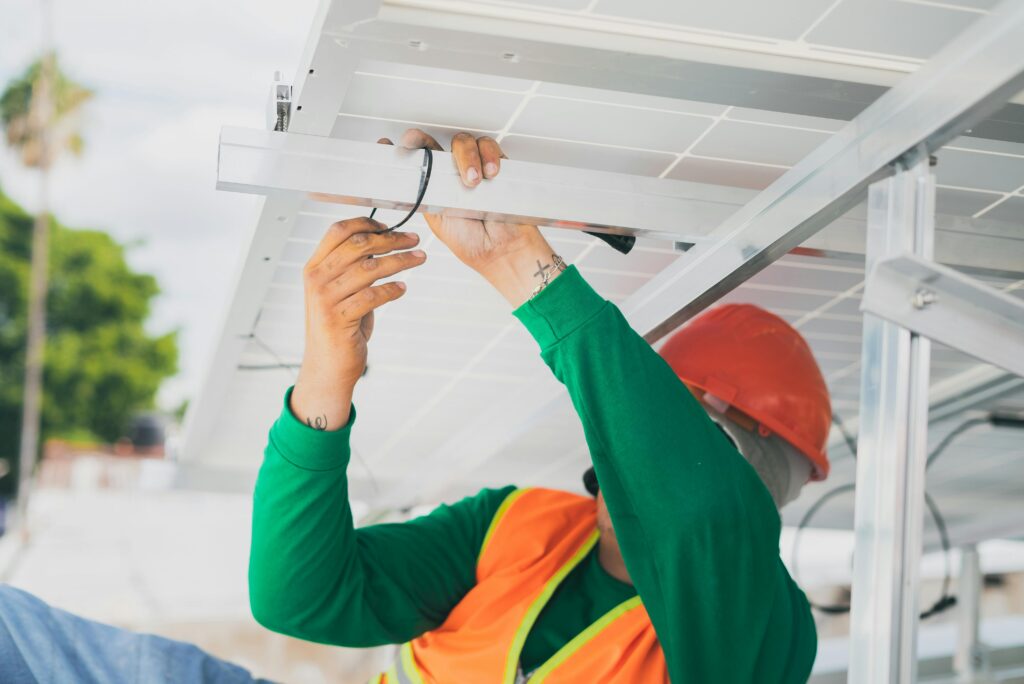 Energy worker working on solar panel