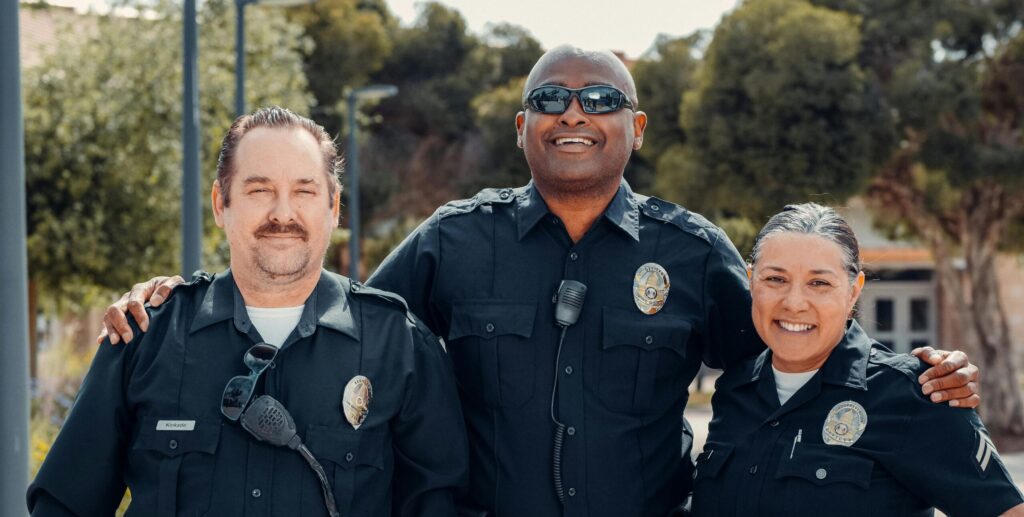 Several people in uniforms smiling