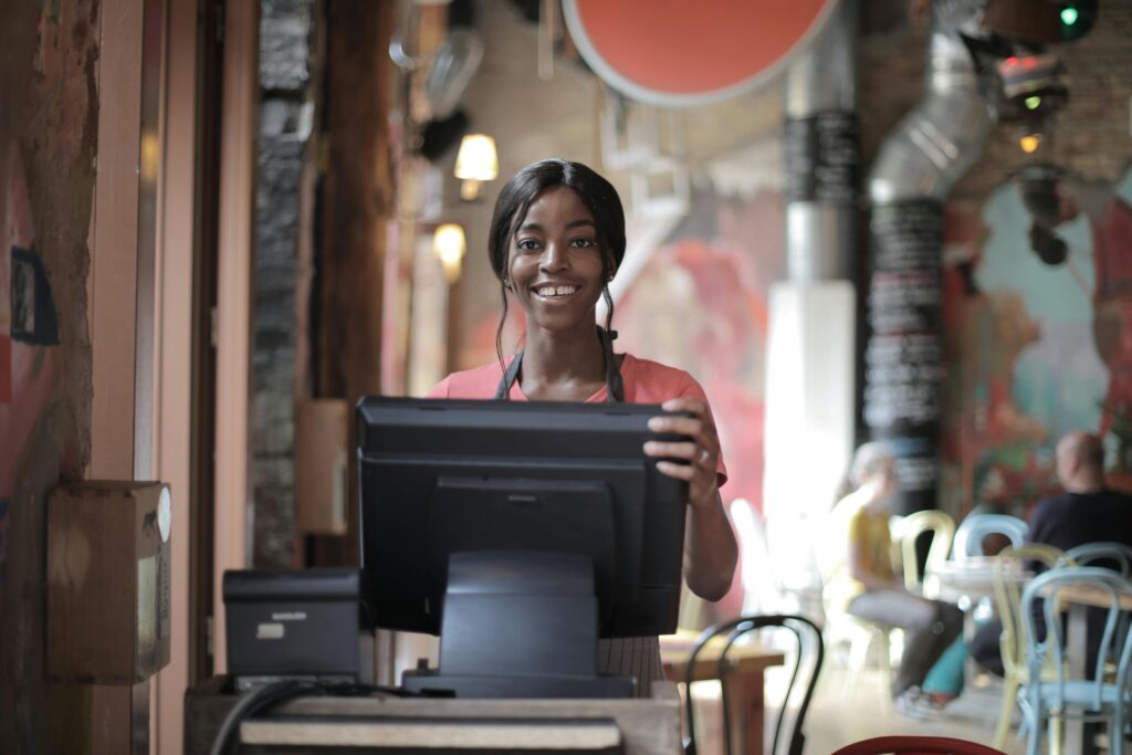 Smiling woman at cash register