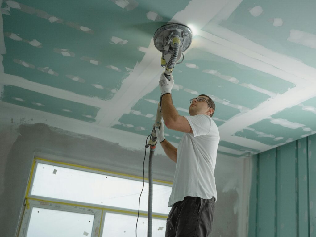 Man working on unfinished ceiling