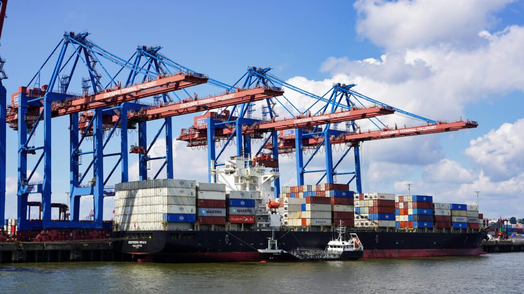 Dock with many transport ships being loaded