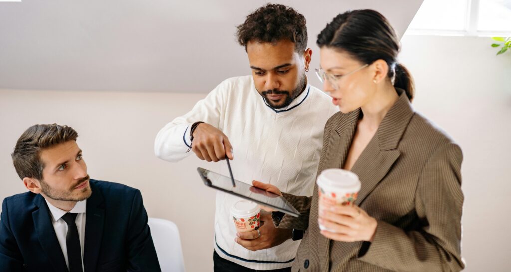Several business people looking at tablet
